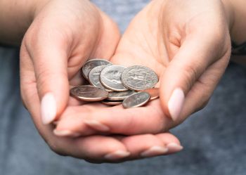 Hands giving money
